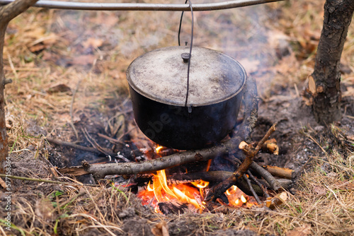 Obraz na płótnie Close-up of a cauldron hung over a campfire w salonie