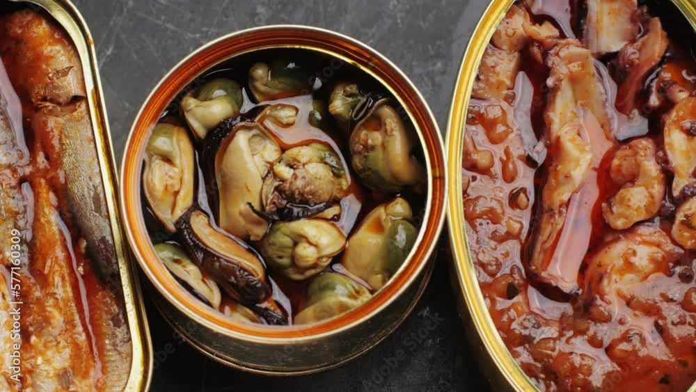 Spanish fish seafood Canned preserves food in tin open cans. sardines