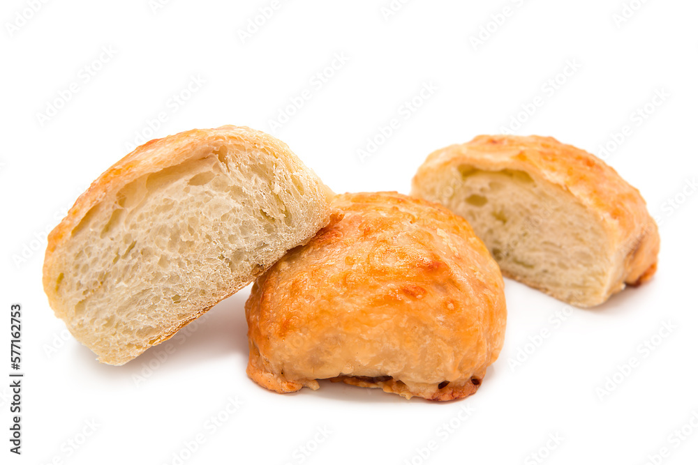Freshly baked cheese buns isolated on white background. Whole bun and cut into halves. Freshly baked cheese buns isolated on white background. Whole bun and cut into halves.