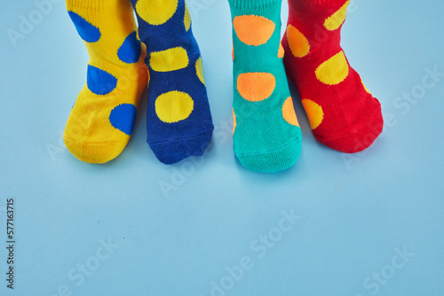 World Down syndrome day background. Legs with different socks as symbol of down syndrome