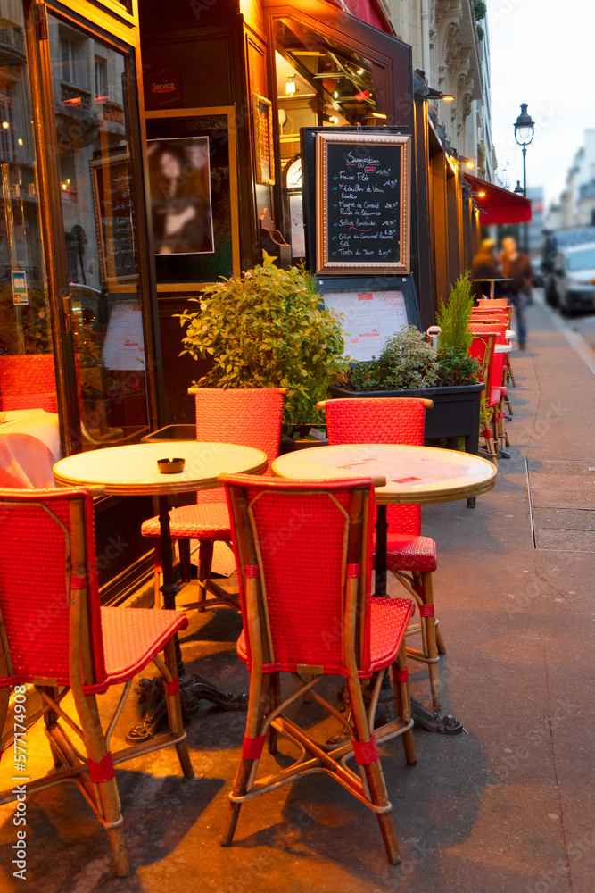 view of romantic Monmartre cafe tables at night close up, Paris, France
