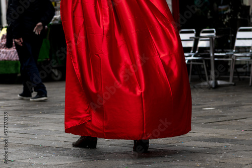 Photo on the streets of Venice of a red cloak. Carnival of Venice.