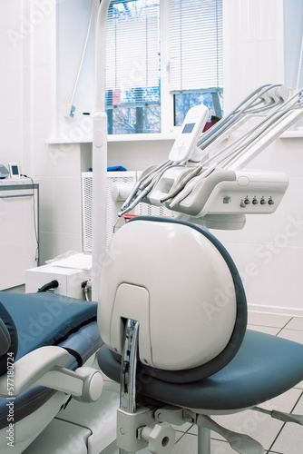 Close-up of dental equipment in dentistry clinic. Workplace and tools of dentists. Dental chair and surgical instruments