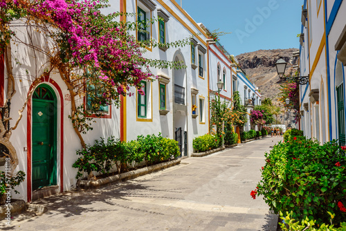 historic center of puerto de mogan with lots of bougainvillea flowers, Canary Island photo