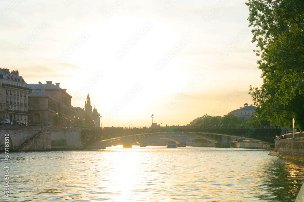 bridges of Paris and Seine river at sunny summer sunset, Paris, France with sunshine