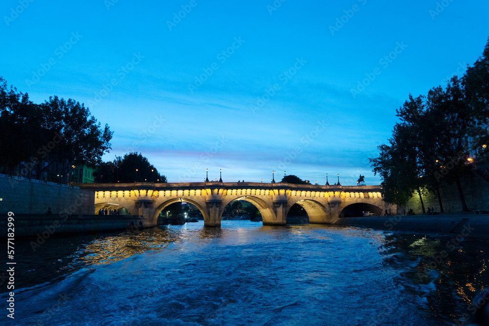bridge Pont Neuf and Seine river at illuminated at blue night, Paris, France