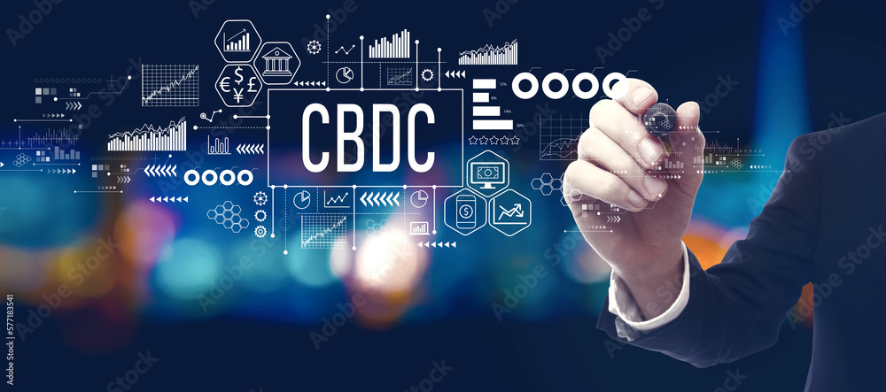 CBDC - Central Bank Digital Currency Concept with businessman in a city at night CBDC - Central Bank Digital Currency Concept with businessman in a city at night