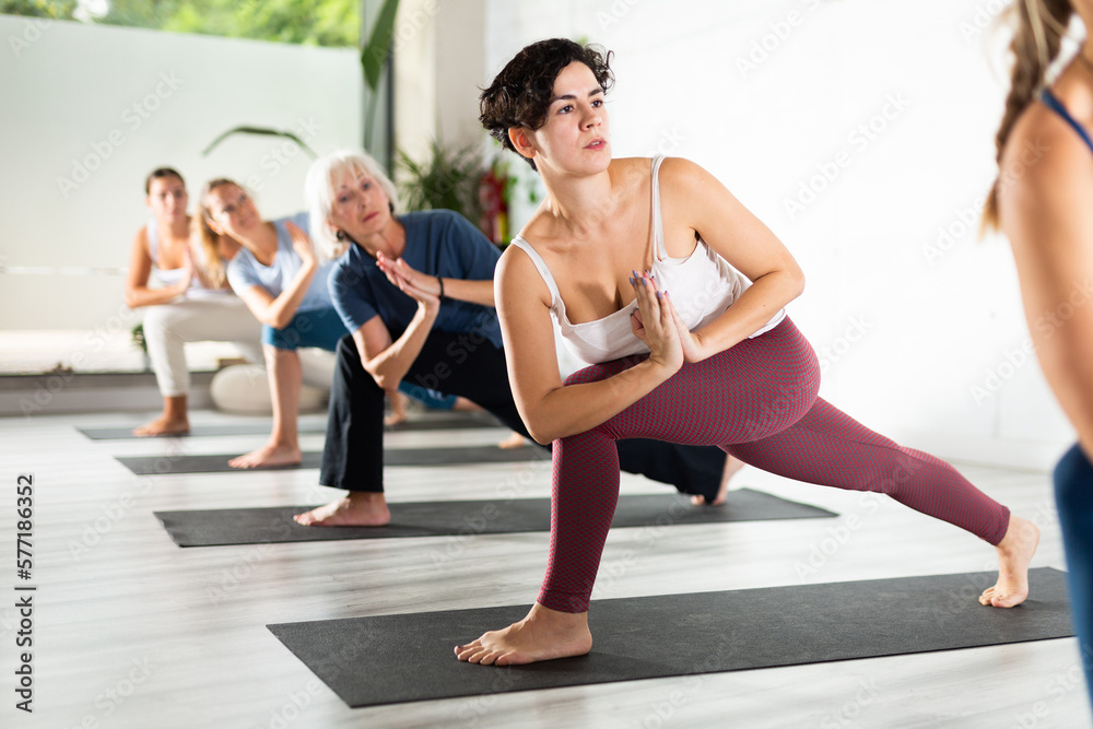 Obraz premium Group lesson on hatha yoga in the studio