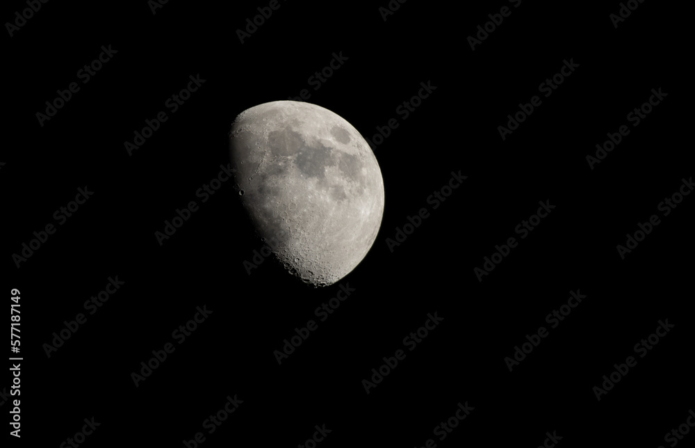 Half moon with black sky background at night Half moon with black sky background at night