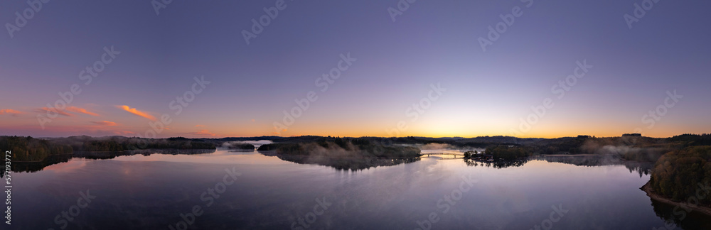 Aerial Panoramic of Lac de Saint Pardoux at sunrise with pink and orange colors in autumn