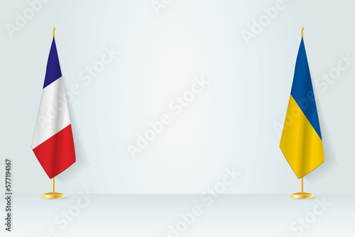 France and Ukraine flag on indoor flagpole, meeting concept between Ukraine and France.