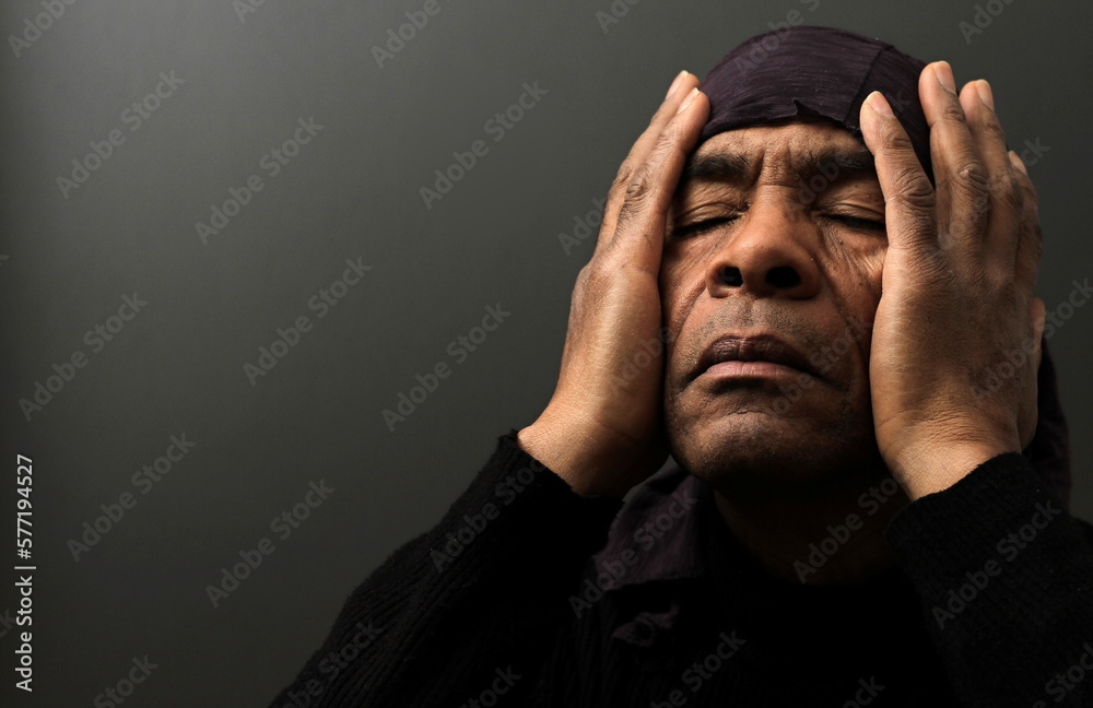 man praying to god with hands together Caribbean man with people praying stock photo man praying to god with hands together Caribbean man with people praying stock photo