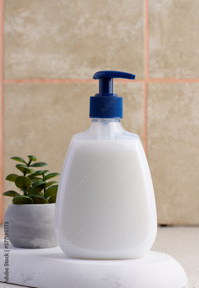 White plastic container with a pump for liquid products. Container for cosmetics, soap, cream White plastic container with a pump for liquid products. Container for cosmetics, soap, cream