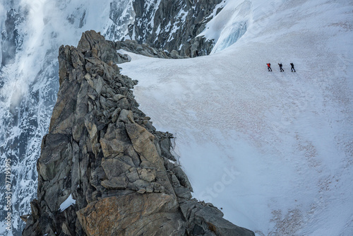 Obraz na płótnie Mountaineers walking on ice in Mont Blanc, hikers and alpine glacier , Chamonix w salonie