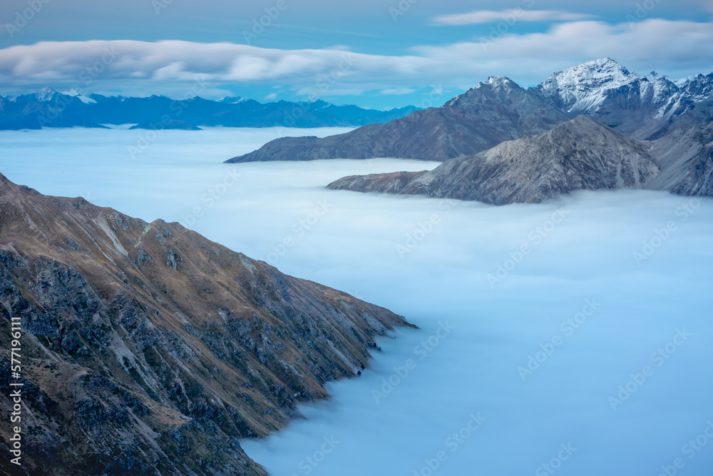 Stelvio pass, mountain dramatic landscape at dawn above mist, Italy