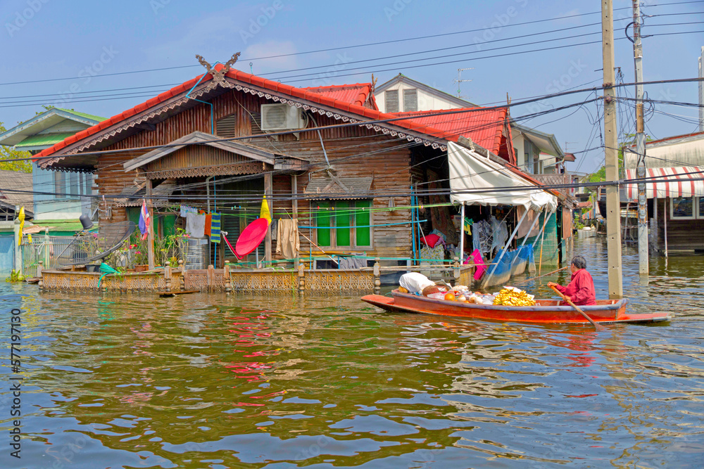 Selling produce on a flooded Khlong (canal) of Thon Buri in Bangkok Selling produce on a flooded Khlong (canal) of Thon Buri in Bangkok