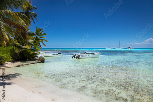 Boats and tropical beach in caribbean sea, Saona island, Dominican Republic