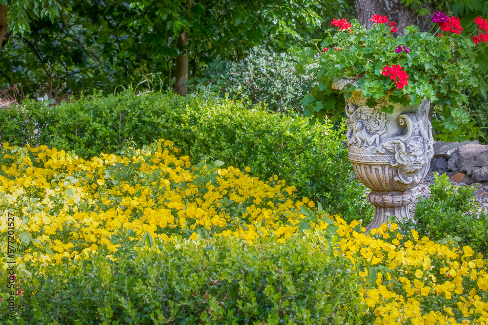 Colorful flowers and vase pot, idyllic landscape in Giverny, France