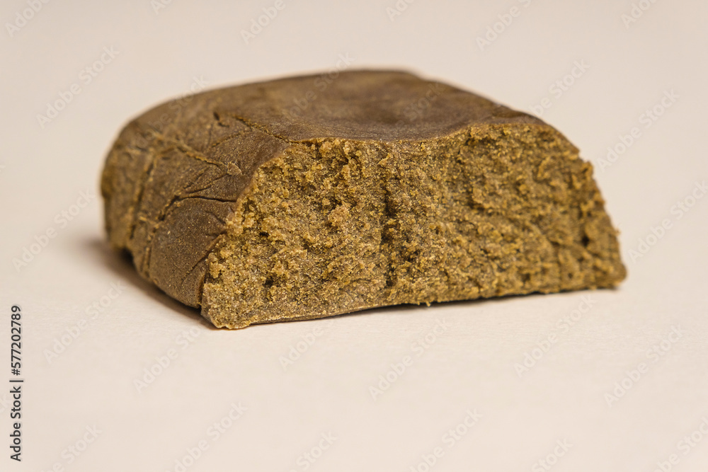 Critical Purple Kush dry base hash. Medical marijuana extraction super dry hashish high quality cannabis pollen on a white background. Critical Purple Kush dry base hash. Medical marijuana extraction super dry hashish high quality cannabis pollen on a white background.