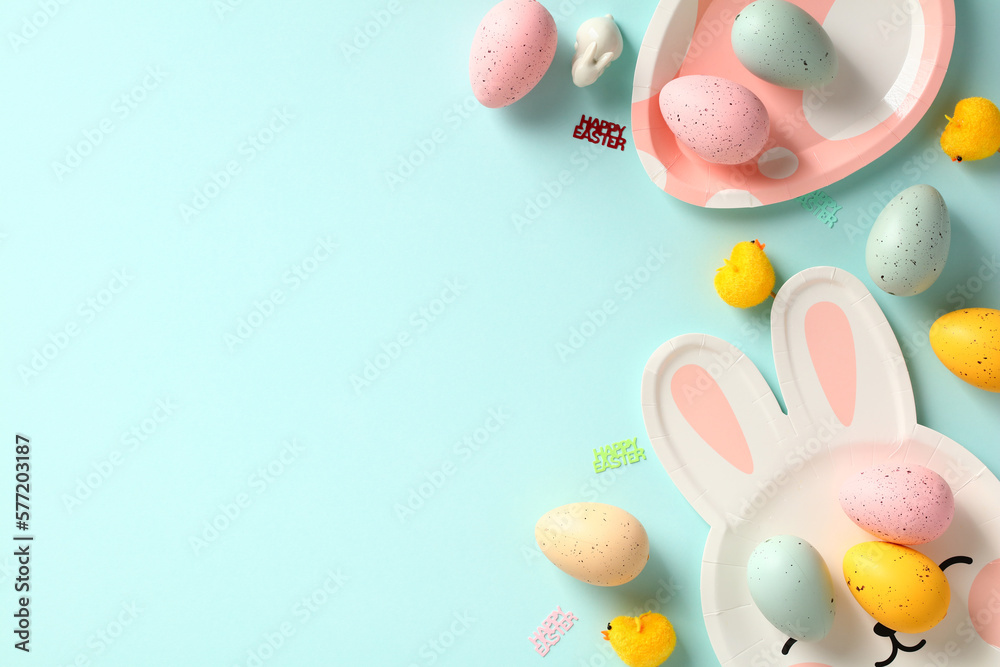Easter flat lay composition with cute plates with colorful Easter eggs on pastel blue background. Easter flat lay composition with cute plates with colorful Easter eggs on pastel blue background.