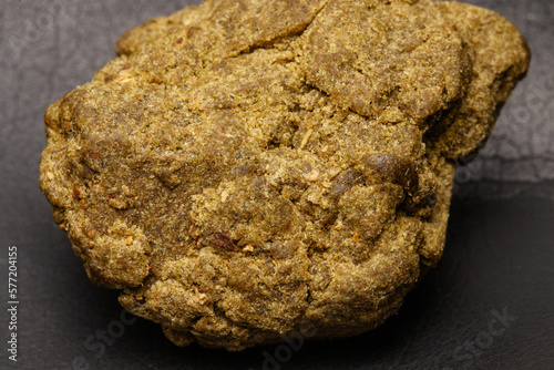 Detail of medical marijuana extraction hash cannabis pollen hashish, texture closeup
