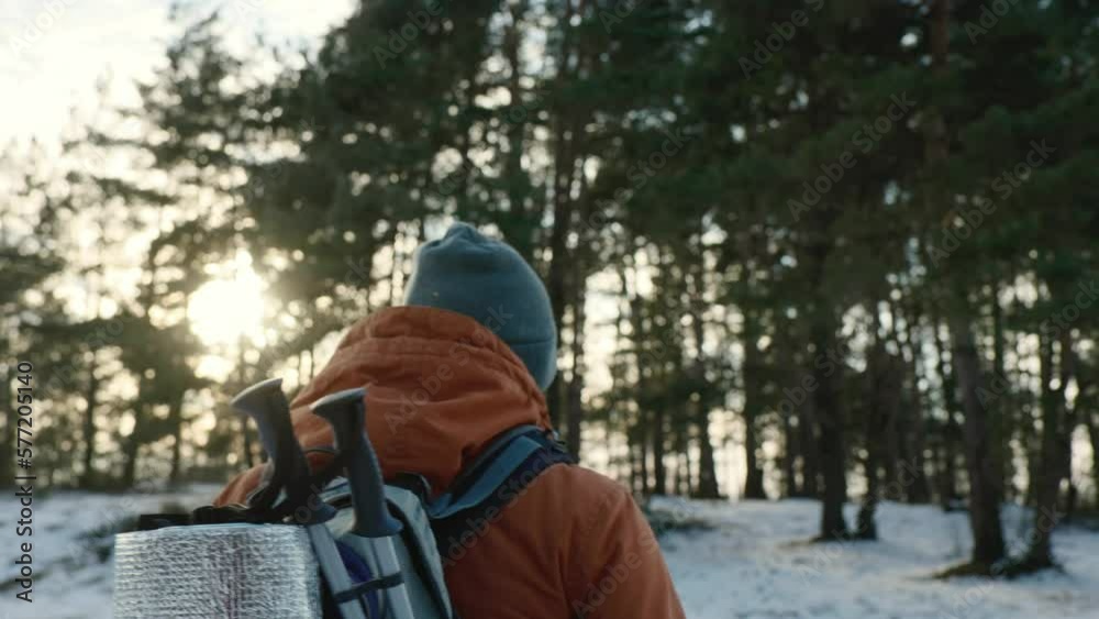 Traveler Man with backpack hiking in winter snowy forest landscape Travel Lifestyle concept adventure active vacations outdoor cold weather into the wild Traveler Man with backpack hiking in winter snowy forest landscape Travel Lifestyle concept adventure active vacations outdoor cold weather into the wild