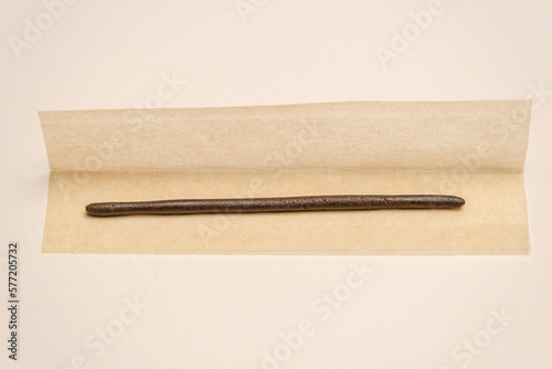 High quality Moroccan hashish, cannabis marijuana extract on rolling paper. Drugs narcotic addiction concept, smoke and chill