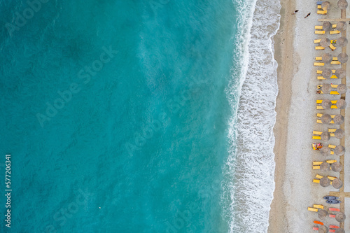 Straight down view on parasols and beach by Bunec Beach area in Summer 2022, Albania