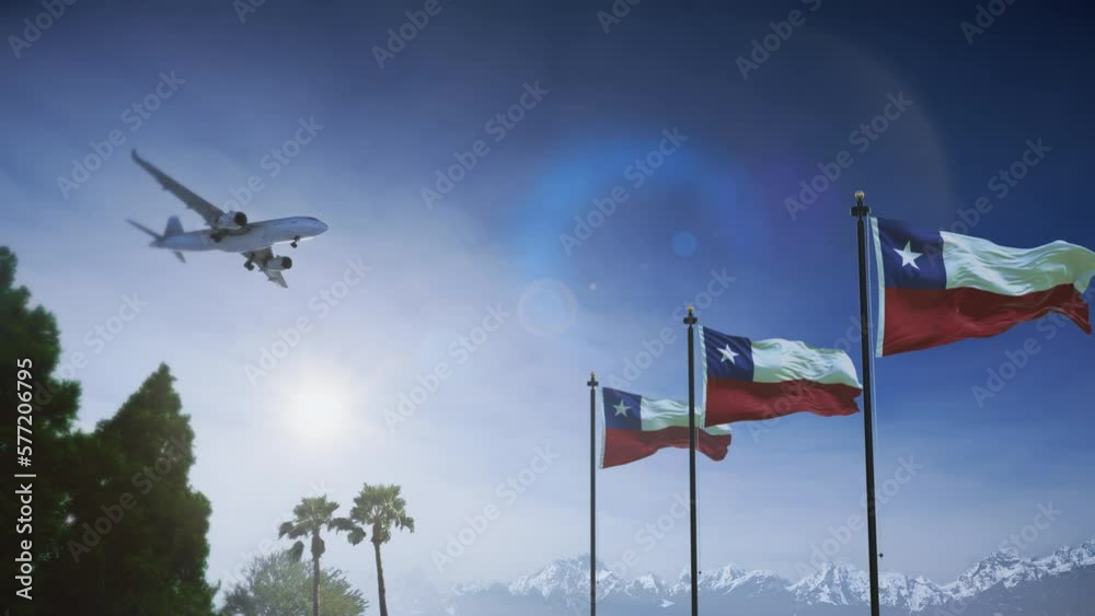 Airplane landing in Chile. A generic passenger plane lowering its landing gears approaching an airport in Chile. Chilean flag waving in front of mountains.
