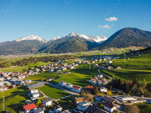 Aerial view Oberperfuss town in Tirol Austria by drone. Alps mountains.