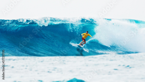 Surfer rides the wave during day