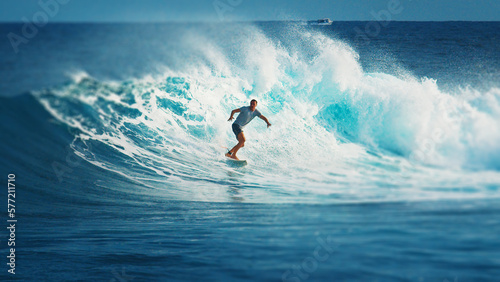 Surfer rides the wave during day