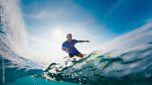 Surfer rides the ocean wave in the Maldives © Dudarev Mikhail