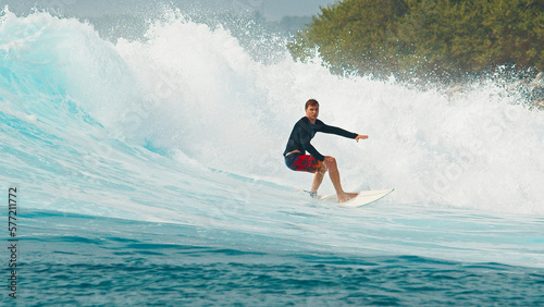 Photography Surfer rides the wave during day