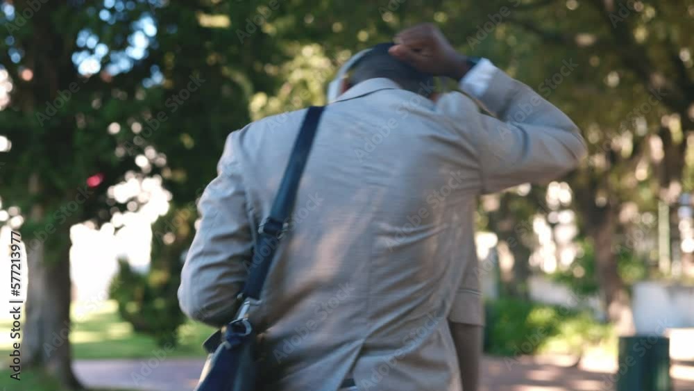 Dance, music and business black man walking in park to work with happy, positive attitude and freedom. Dancing, wellness and back of male worker on urban commute listening to radio, track and audio Dance, music and business black man walking in park to work with happy, positive attitude and freedom. Dancing, wellness and back of male worker on urban commute listening to radio, track and audio