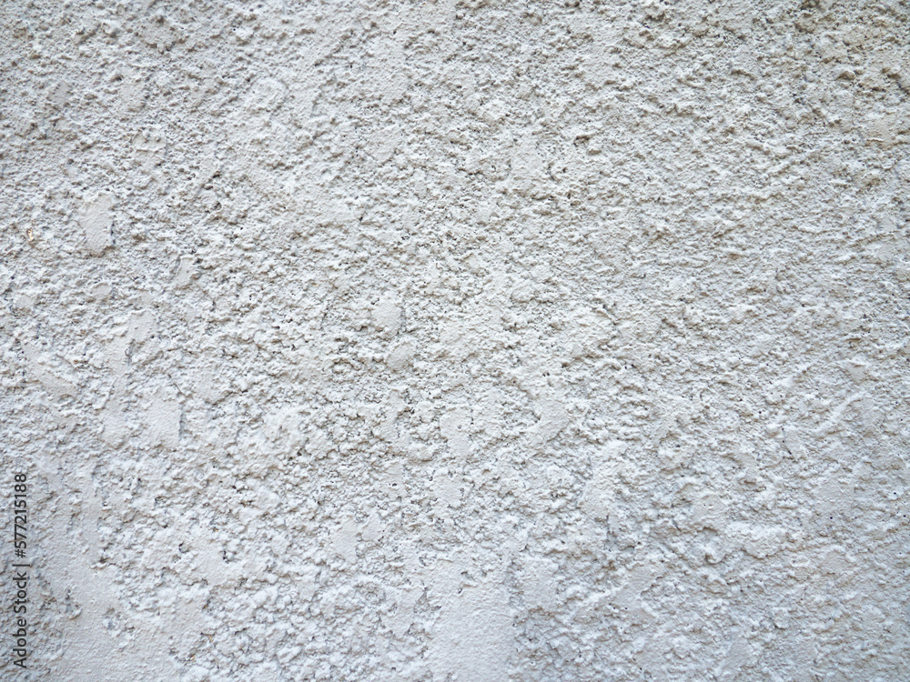 Rough light surface. Background from a stone wall. Cement stains.  White background