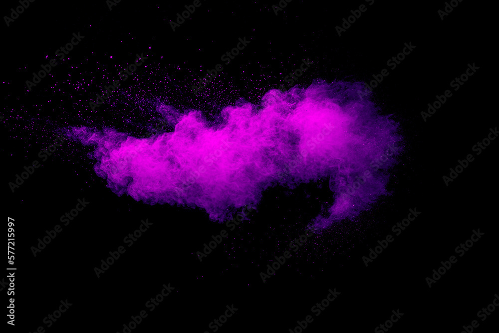 Purple color powder explosion cloud on black background.Purple dust particles splash. Purple color powder explosion cloud on black background.Purple dust particles splash.