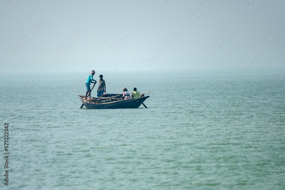 11th February, 2023, Sundarban, West Bengal, India: A fisher man family going for fishing with their country boat at Sundarban Tiger Reserve. 11th February, 2023, Sundarban, West Bengal, India: A fisher man family going for fishing with their country boat at Sundarban Tiger Reserve.