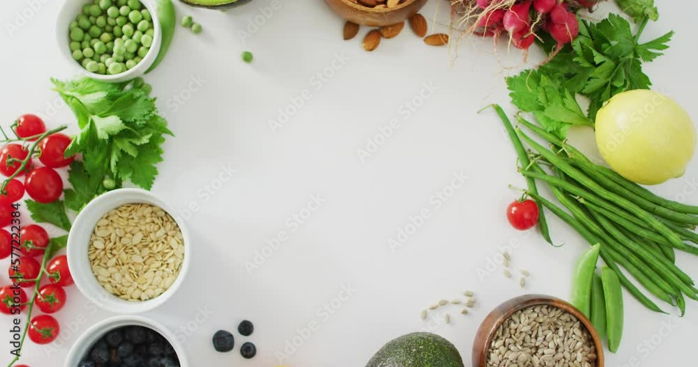 Video of fresh vegetables, seeds and berries with copy space on white background Video of fresh vegetables, seeds and berries with copy space on white background