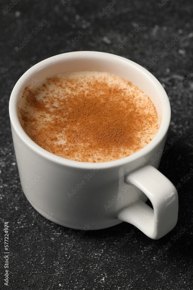 Cup of delicious eggnog on grey table Cup of delicious eggnog on grey table