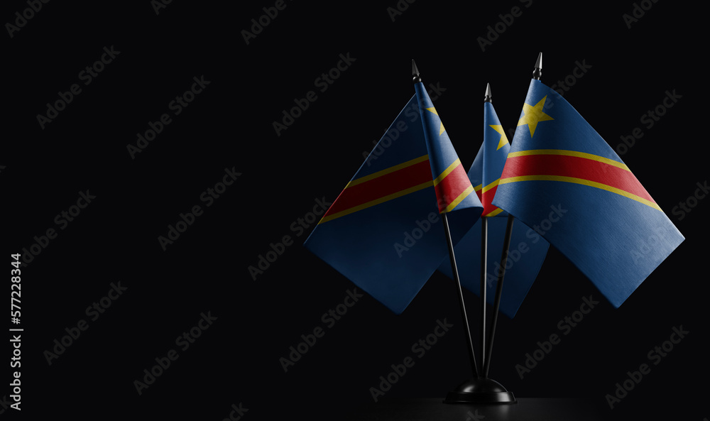 Small national flags of the Democratic Republic of the Congo on a black background