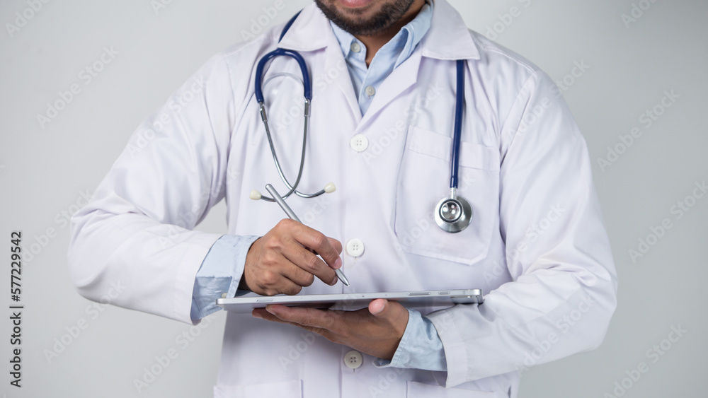 male doctor is holding stethoscope into the camera male doctor is holding stethoscope into the camera