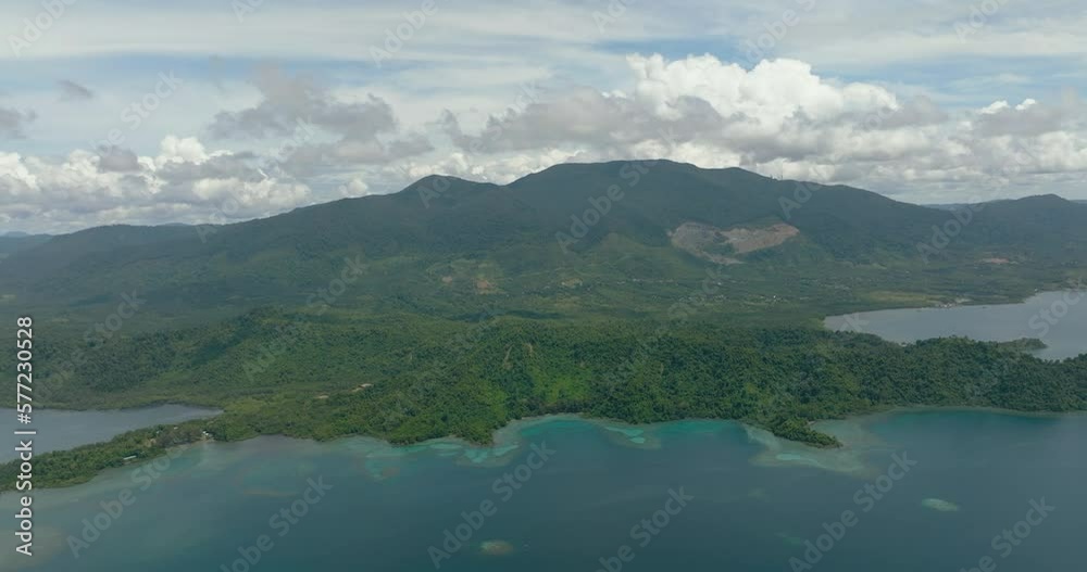 View from the sea on the coast of the island of Borneo with tropical vegetation. Sabah, Malaysia. View from the sea on the coast of the island of Borneo with tropical vegetation. Sabah, Malaysia.