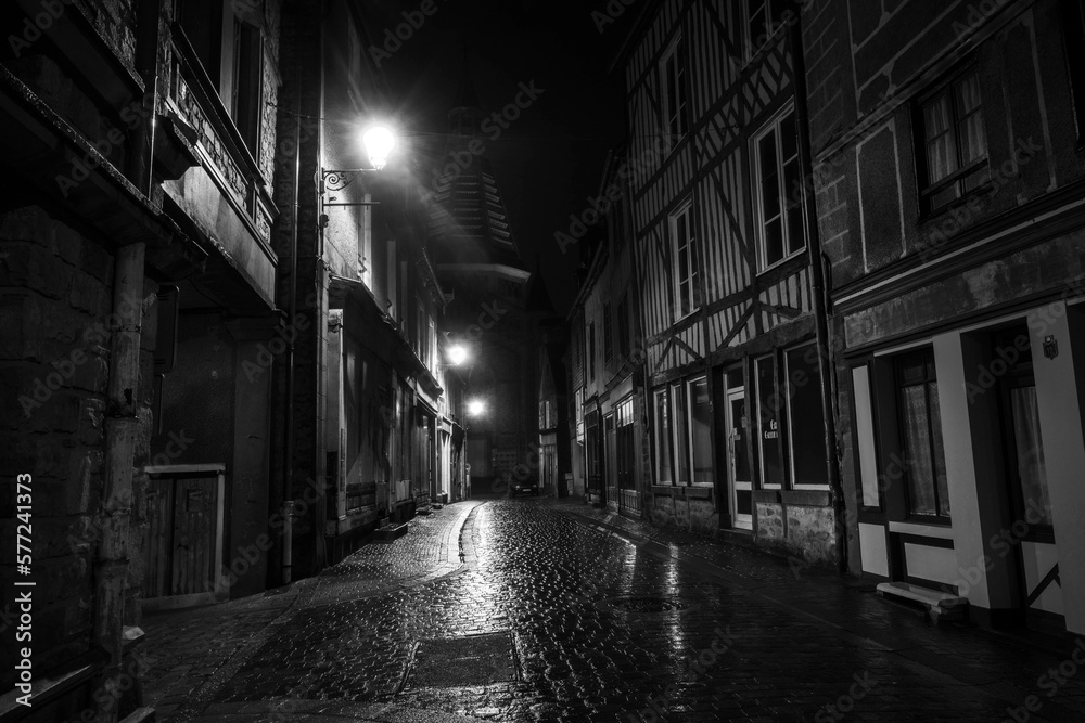 City of Domfront In Normandy, France during a rainy night - obrazy, fototapety, plakaty 