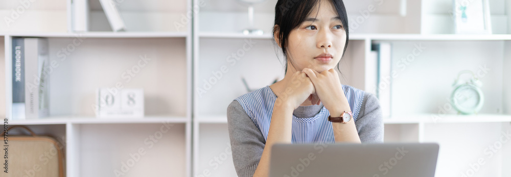 Young studying online uses his laptop in a live performance to communicate with his friends and teachers, Using laptops and data graphs in class, Online communication, Social distancing.
