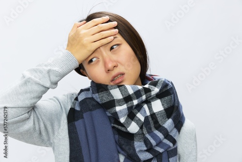 Asian woman cold flu raised hands from headache with fever sick from covid 19 virus on white background, copy space