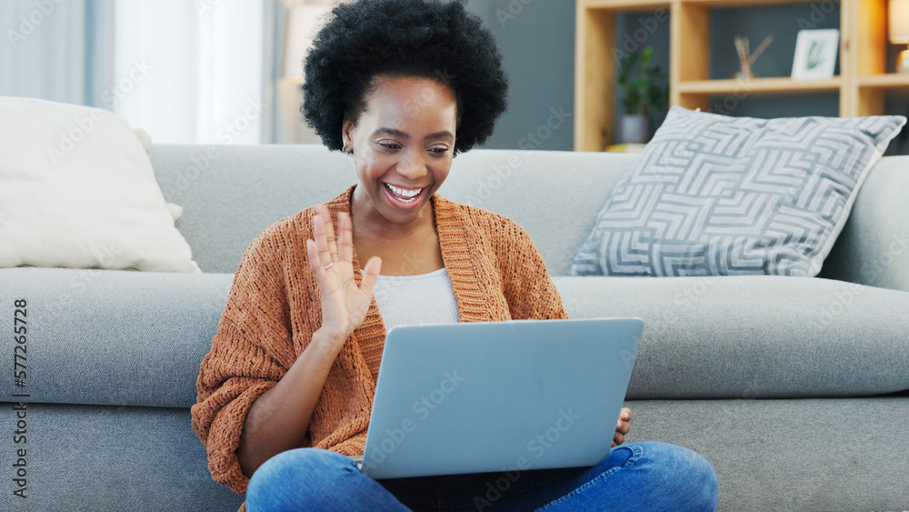 Happy African American woman using laptop and waving on a video call in ...