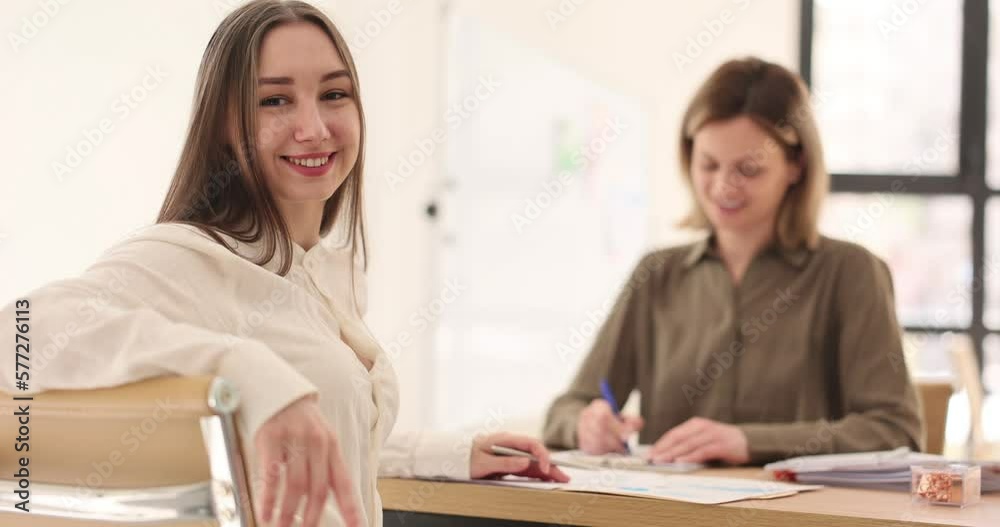Smiling internship student girl successfully passed interview in office Smiling internship student girl successfully passed interview in office