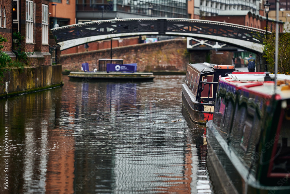 Colorful boats, houses on the water in the canals of Birmingham