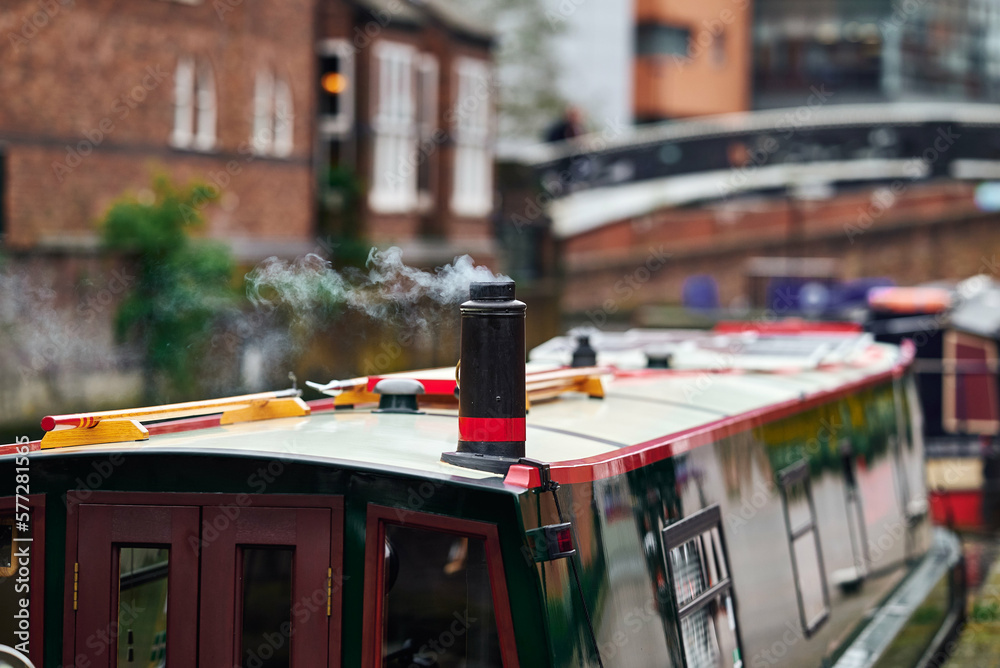 Colorful boats, houses on the water in the canals of Birmingham